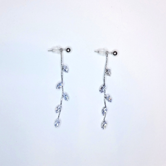 Elegant, simple crystal silver color metal dangle earrings with plastic backing. - Picture 5 of 5